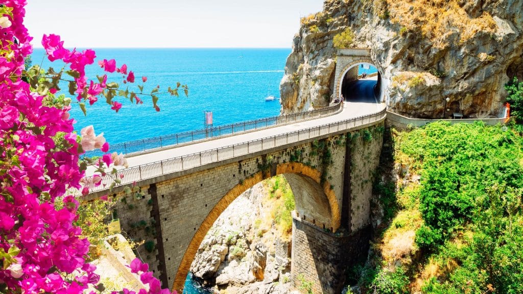 Travel to Italy along the Amalfi Coast, where dramatic landscapes and coastal villages define the experience.